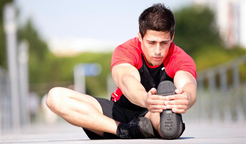 Man Stretching at Swissotel The Stamford